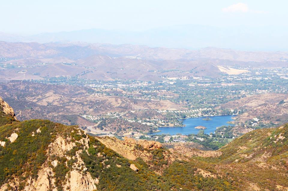 A view of a lake nestled in the hills